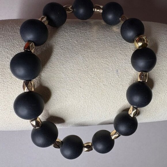 bold and modern bracelet with matte black round beads and gold spacers - Picture 2 of 3